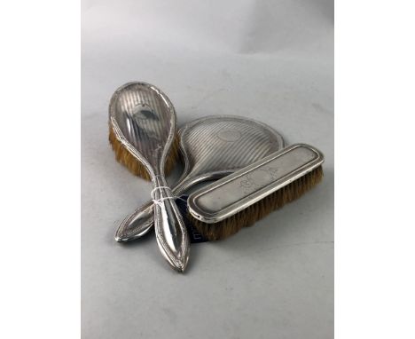 SILVER CIGARETTE CASE, along with a silver hand mirror, two silver backed brushes, two silver topped glass jars, silver toppe