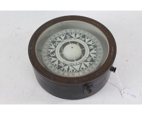 Brass and ebonised ships compass by B Cooke &amp; Son Ltd. Hull, number 2046, the gimballed compass housed in a brass and ebo