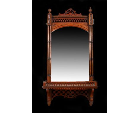 Victorian wall mirror, the moulded frieze above a bevelled mirror plate, flanked by turned balusters, on a rectangular shelf 