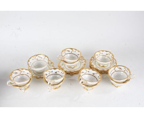 Crescent &amp; Sons porcelain tea ware, including twelve cups and saucers and a bowl, decorated in gilt on a white ground (qt