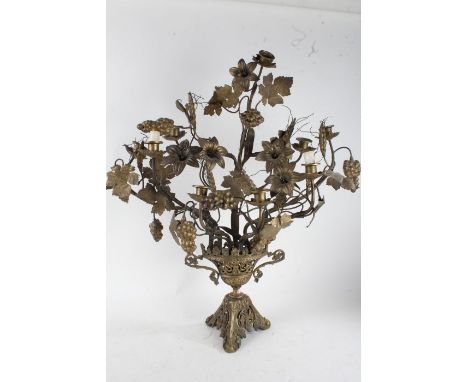 20th century brass nine branch candelabra, having ornately applied flowers, leaves and grape vines, approx. 75cm high, togeth