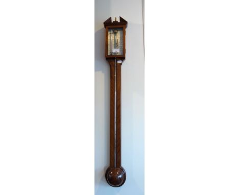 A GEORGE III STYLE MAHOGANY STICK BAROMETER with a steel face and a mahogany pole screen with a needlework banner (2)