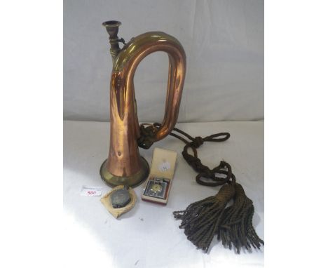 A COPPER AND BRASS BUGLE, inscribed 'Besson &amp; Co, London' and a Trench Art lighter with another similar