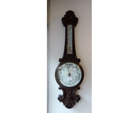 A VICTORIAN OAK BANJO BAROMETER