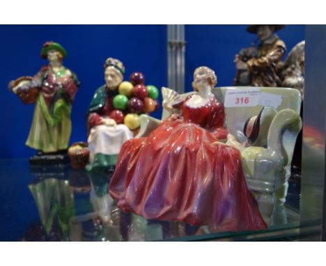 ROYAL DOULTON; A FIGURE OF A WOMAN ON A SOFA, "Sweet & Twenty", "The Old Balloon Seller" HN 1315 and "Sweet Lavender" HN 1373