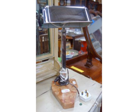 AN ART DECO DESK LAMP with adjustable chrome fittings on a shaped marble base, 40 cm high