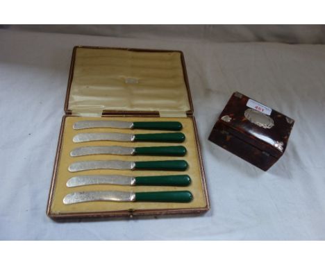 A TORTOISESHELL BOX with silver mounts and a cased set of butter knives (2)