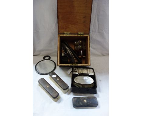 A SILVER CLOTHES BRUSH in a fitted presentation case, and a dressing table set in a wooden box 