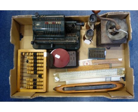A VINTAGE ADDING MACHINE, similar slide rules, equipment a Victorian coffee grinder and sundries