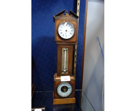 A LATE VICTORIAN CLOCK in the form of a miniature longcase clock, with a rosewood and fan inlaid case and inset barometer and