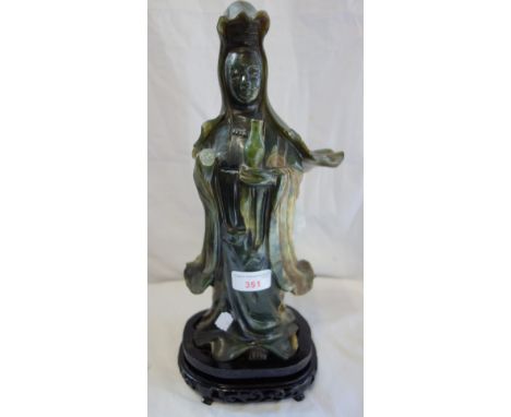 A CHINESE JADE FIGURE OF A FIGURE in traditional costume, 38 cm high (inc base) hand missing