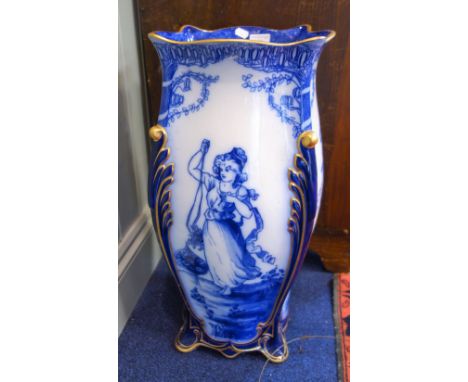 A ROYAL DOULTON STICK STAND in blue and white, each side decorated with women, 60 cm high