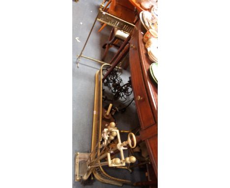 A 19TH CENTURY BRASS FENDER a brass framed dressing mirror, a collection of wrought iron light fittings and similar metalware