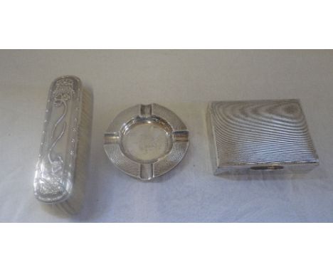 A SILVER CIGARETTE BOX with engine turned decoration, an ash tray and a silver backed clothes brush (3)