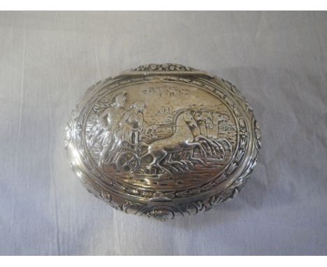 A VICTORIAN SILVER DRESSING TABLE BOX, oval form decorated with a classical scene (3.3oz)