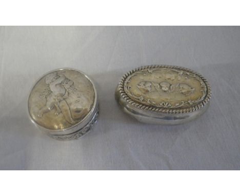 A VICTORIAN POWDER POT embossed with putti, circular form (1.8oz) and a Victorian silver box of oval form, embossed with thre