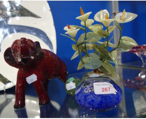 A CAITHNESS PAPERWEIGHT decorated with a crown and "50", a "jade" tree, an Oriental egg and a Doulton Flambe elephant (damage