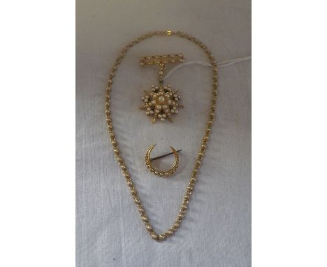 A PEARL STAR BURST BROOCH, a crescent brooch and a necklace 