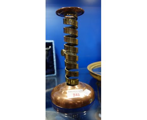 A BRASS AND COPPER ADJUSTABLE "SPIRAL" CANDLESTICK, 21 cm high