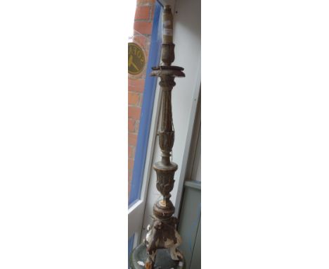 AN ALTAR CANDLESTICK in carved wood and gesso, converted to electricity, 88 cm high (plus candle/fitting)