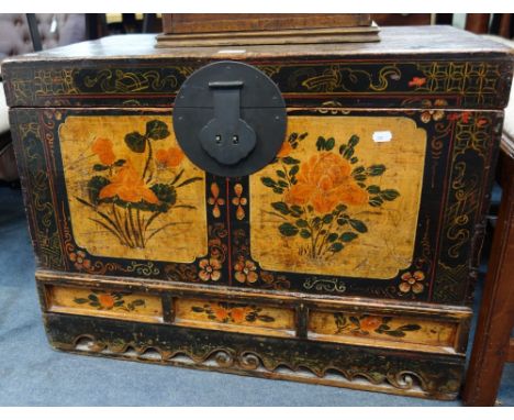 AN ORIENTAL WOODEN TRUNK with painted floral decoration to the front, 75 cm wide