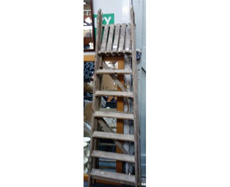 A SET OF VINTAGE WOODEN STEP LADDERS