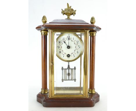 Mahogany and brass mantle clock with bevelled glass panels.  Movement trips through when wound.  Sold as not working.  Key an
