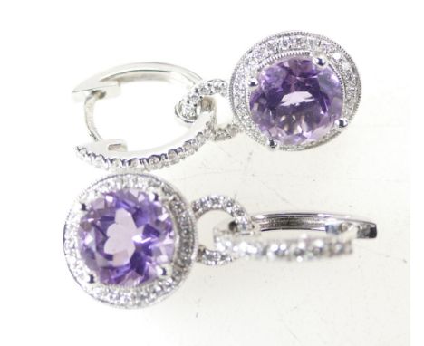 18ct White gold pair earrings, each set with an 8mm Amethyst stone surrounded by 44 diamonds, 6.4 grams, with 2011 Costco App