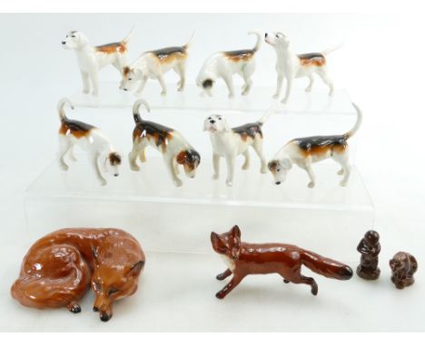 A collection of Beswick first and second version foxhounds, curled fox and running fox (10)