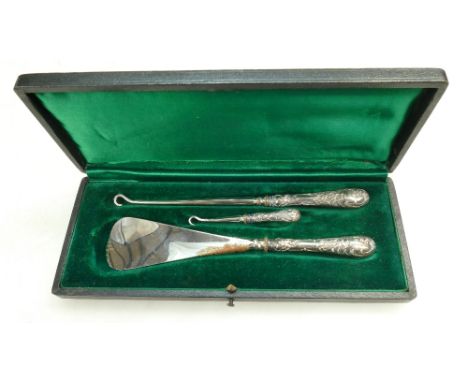 Cased silver handled Shoe Horn and two sizes of button hooks.