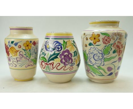 A collection of floral decorated Poole Pottery vases (height of tallest 25cm) (3)