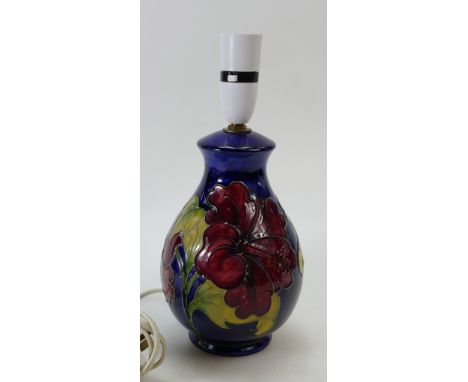 A Moorcroft Hibicus on blue ground small lamp base. Height 28cm