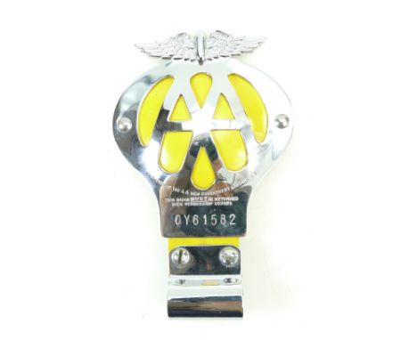 An Automobile Association car badge numbered OY61582 in good condition