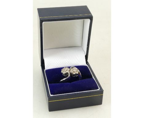 18ct White gold ladies diamond Crossover ring, each round set containing 7 diamonds, size K, 6 grams