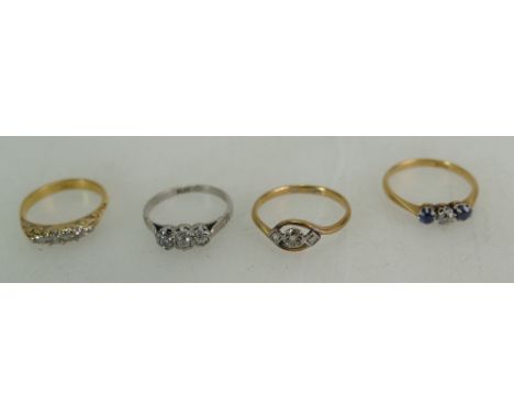 Four diamond rings - platinum and three diamond ring, 9ct and platinum three stone ring, 18ct five stone diamond ring and an 