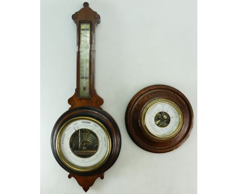 An antique walnut Barometer and Thermometer 50cm, together with a circular oak barometer 19cm (2).