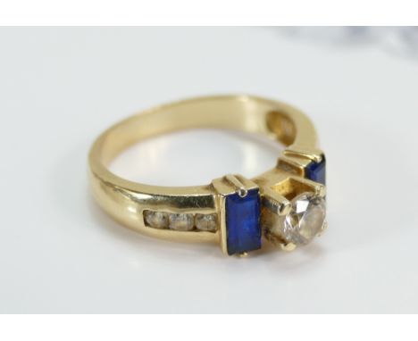 14ct Gold Diamond and Sapphire ladies ring, centre round diamond .50ct, ring size P/Q, 4.5 grams with diamond authenticity ce