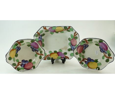 Charlotte Rhead Burleighware footed bowl and pair dishes decorated in the fruit design, length 26cm (crack to both dishes) (3
