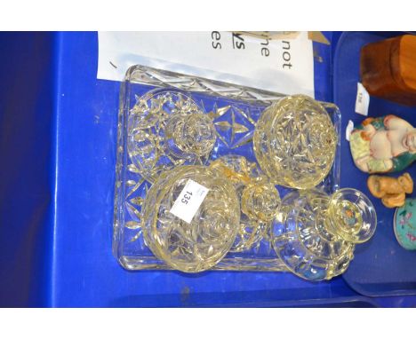 A glass dressing table set