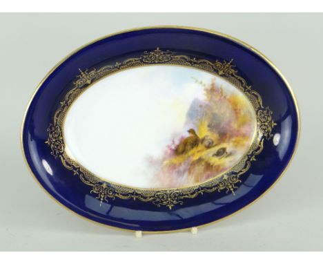 ROYAL WORCESTER PORCELAIN OVAL DISH having cobalt blue border and painted interior with a group of grouse, signed by George J