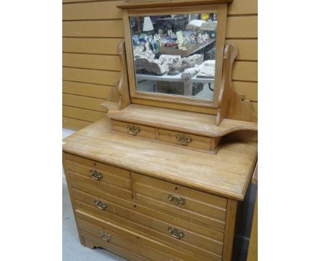 A VINTAGE PINE MIRROR BACKED DRESSING TABLE, with two short above two long, a two drawer mirrored top, 163cms tall x 106cms w