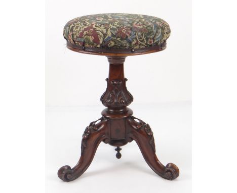ANTIQUE ADJUSTABLE CIRCULAR STOOL on decoratively carved three legged base