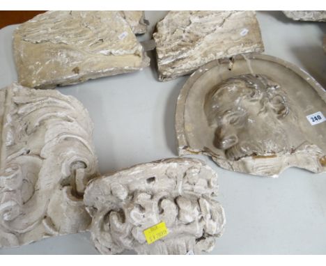 FIVE VICTORIAN PLASTER MAQUETTES, angels wings, a roundel, a man's head, architectural pieces. (5 in total) the longest 33 x 