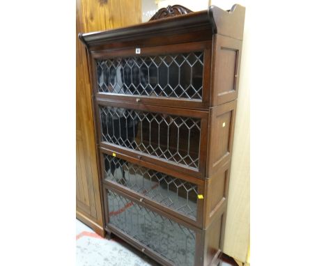 FOUR SECTION GALLERY TOPPED GLOBE WERNICKE STYLE BOOKCASE with leaded glass front