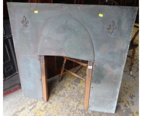 A VINTAGE COPPER FIRE SURROUND with fleur de lis decoration, 100cms tall x 102cms wide