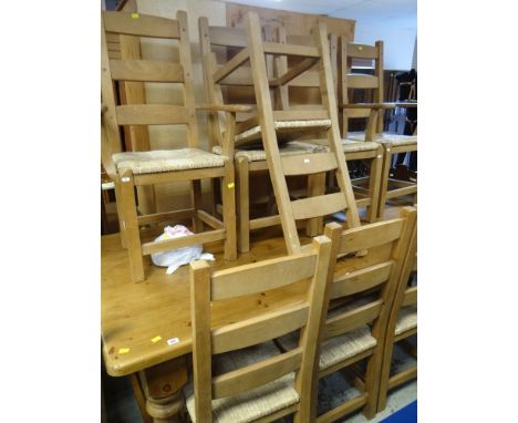 SUBSTANTIAL PINE TOP DINING TABLE, 213 x 117cms, together with a set of eight rush seated and ladder backed chairs (2+6)