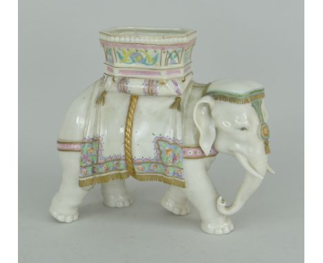 ROYAL WORCESTER PORCELAIN IVORY GLAZED INDIAN DOMESTIC ELEPHANT, the howdah decorated in gaudy floral pallet, 19.25cms high