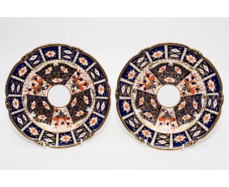 A pair of Royal Crown Derby plates circa 1926 in In Imari print with diameters of 23cm.