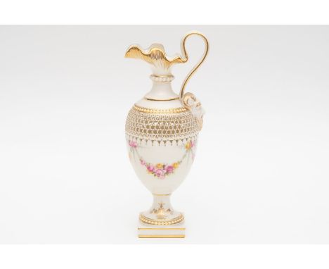 A royal Worcester reticulated ewer with flowers signed Ernest Phillips. Approximately 15cm in height. Circa 1914.