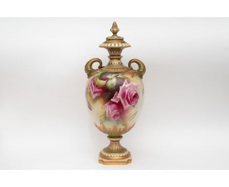 A royal Worcester vase and cover measuring approximately 39cm in height. It is rose decorated and signed by Jarman, circa 190